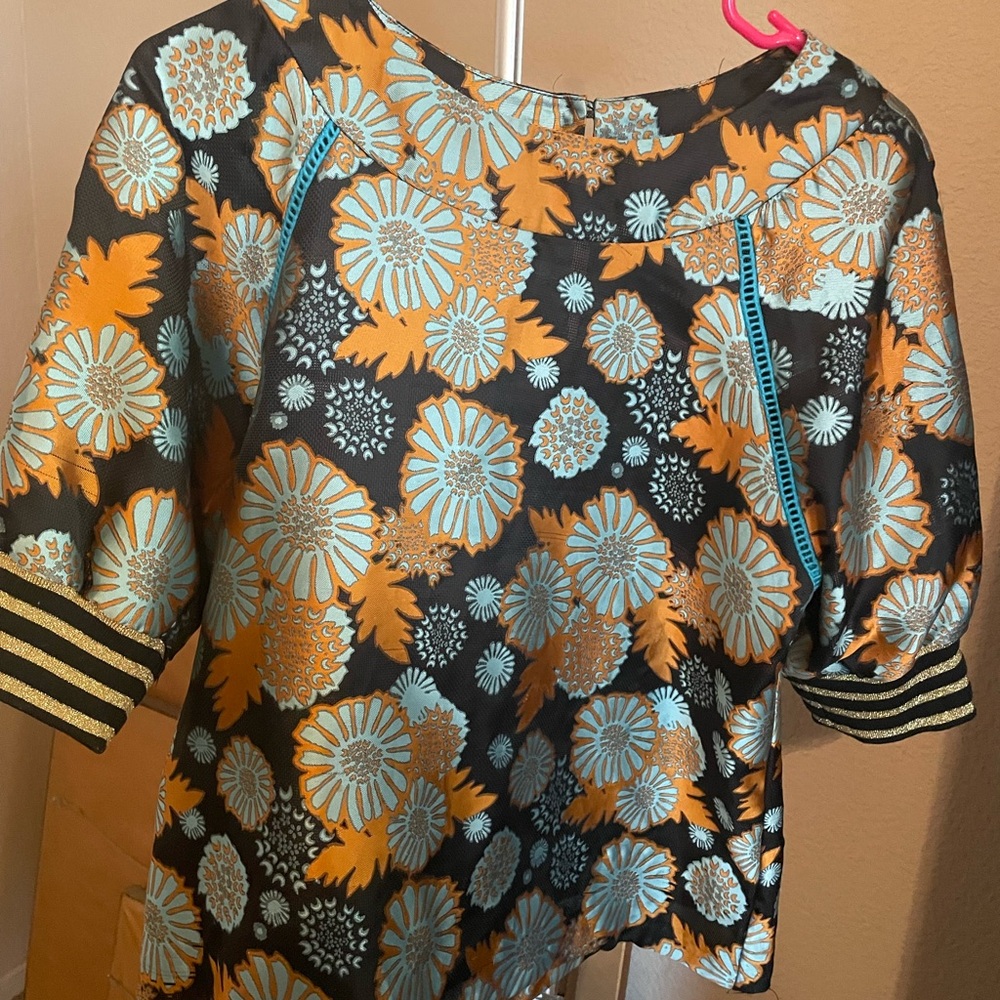 Floral Patterned Top with Orange and Blue Accents